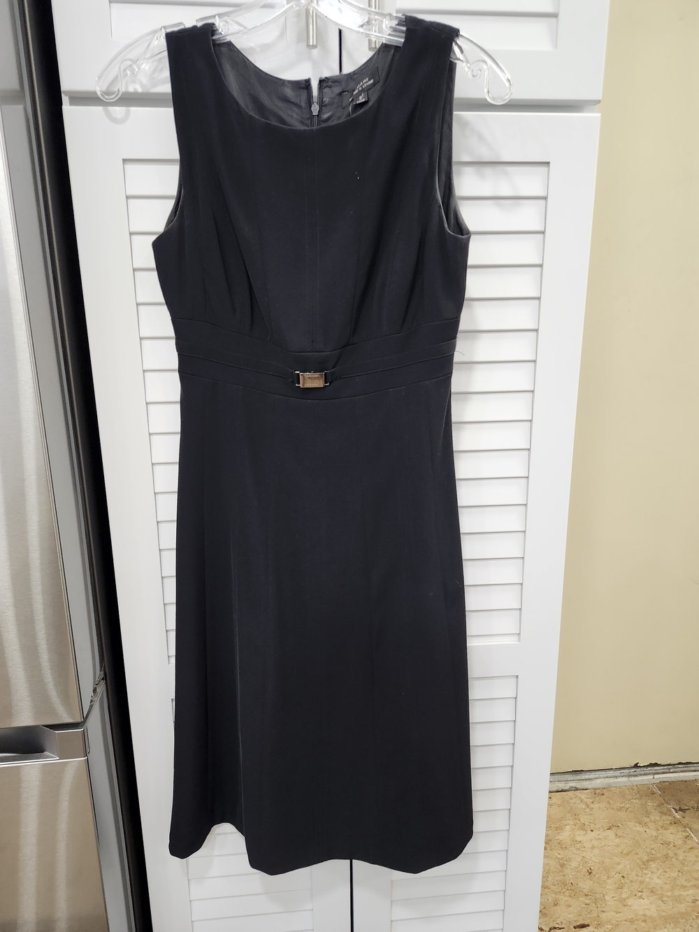 Classic Sleeveless Black Dress with Waist Detail